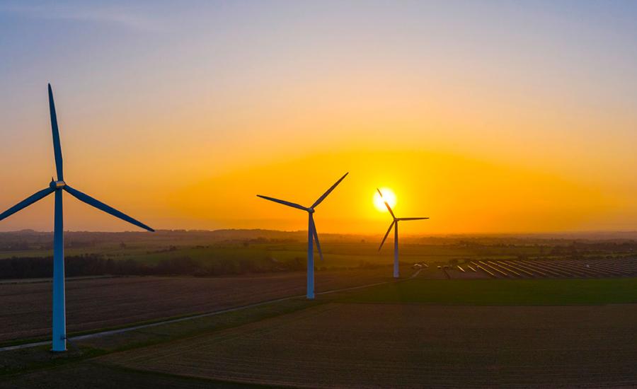 Image of power generating windmills among agricultural fields