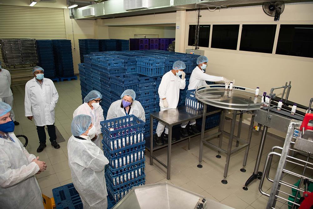 During the facility tour, the delegation watched as Camelicious staff placed bottles of camel milk into crates.