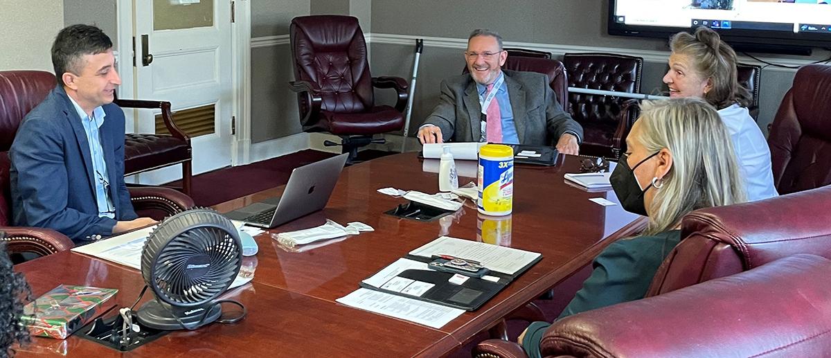 Turkish scientist Dr. Kemal Melih Taskin (left) shares his experiences and successes as a 2019 Cochran Fellow with GLP Deputy Administrator Mark Slupek and Managing Director Mary Anne McElroy.