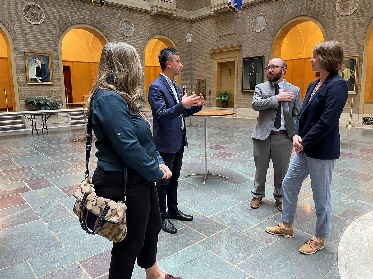 North Carolina State professor Dr. Adrienne Tucker (left) and Turkish scientist Dr. Kemal Melih Taskin (center) visit the Whitten Patio with International Program Specialists Zack Tipton (middle right) and Chris Biles (far right) during a tour of the USDA building.