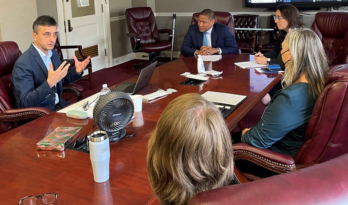 Turkish scientist Dr. Kemal Melih Taskin (left) discusses his research in biotechnology for his Borlaug Fellowship with FAS Administrator Daniel Whitely (center) and FAS Associate Administrator Brooke Jamison.