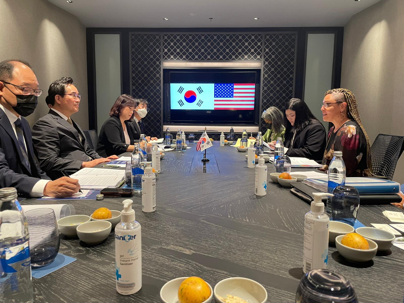 US and Korean officials seated at a table