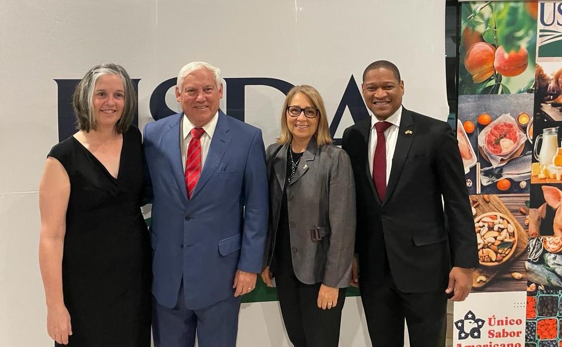 Two women and two men standing in front of USDA logo