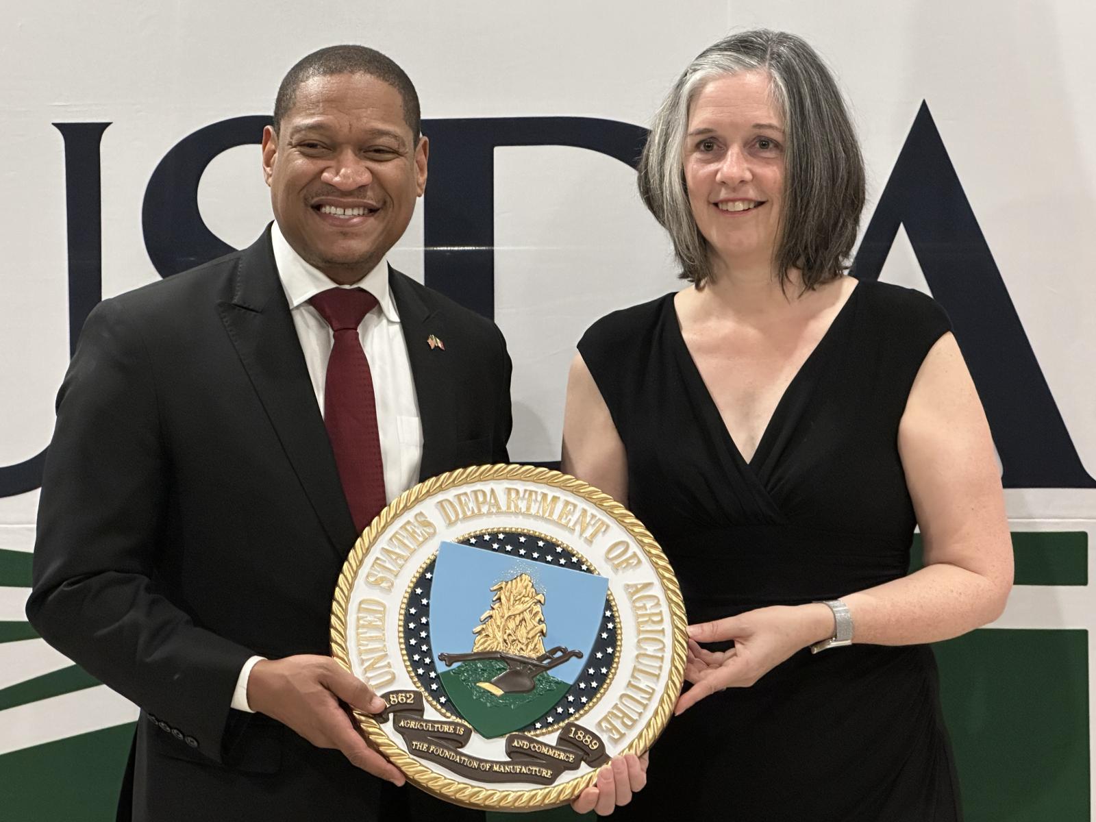 FAS Administrator and US Consul-General hold USDA seal