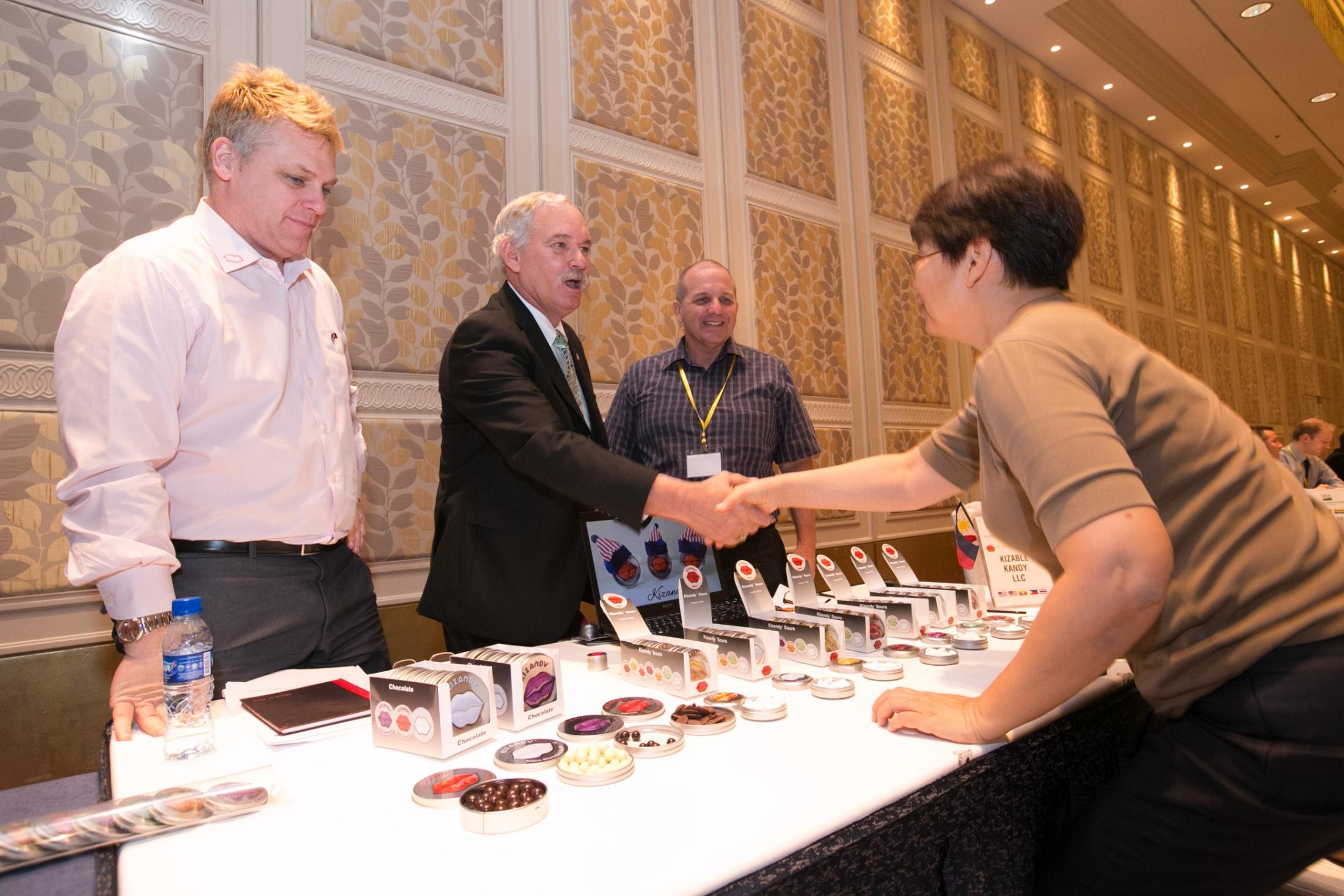 Kizable LLC’s Brian Shroeder (far left) and Michael Busby (third from left) take a moment during the Southeast Asia ATM to introduce Under Secretary Michael Scuse to one of the company’s one-on-one business meeting counterparts in the Philippines.