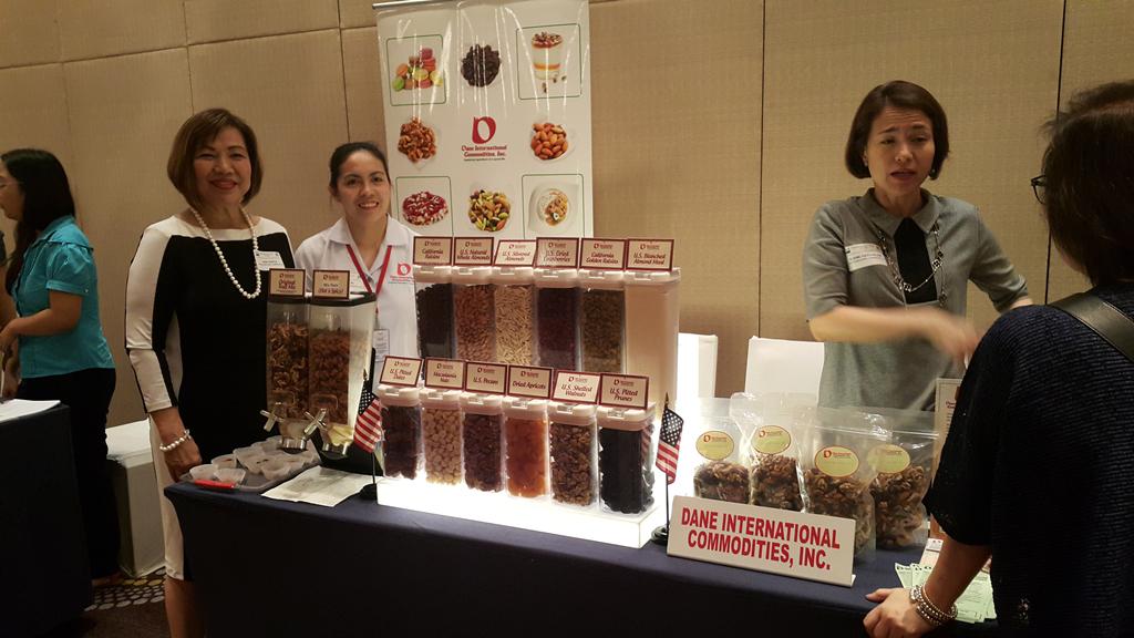 Dane International Commodities, Inc., a Philippine importer specializing in the supply of U.S. nuts, California raisins, other dried fruits and food ingredients, showcases its products to food franchises attending a marketing event in Manila organized by 